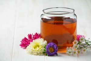 Delicious honey on white wooden backgroud